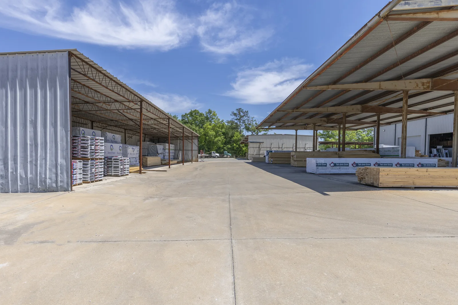Covered building materials storage and loading area