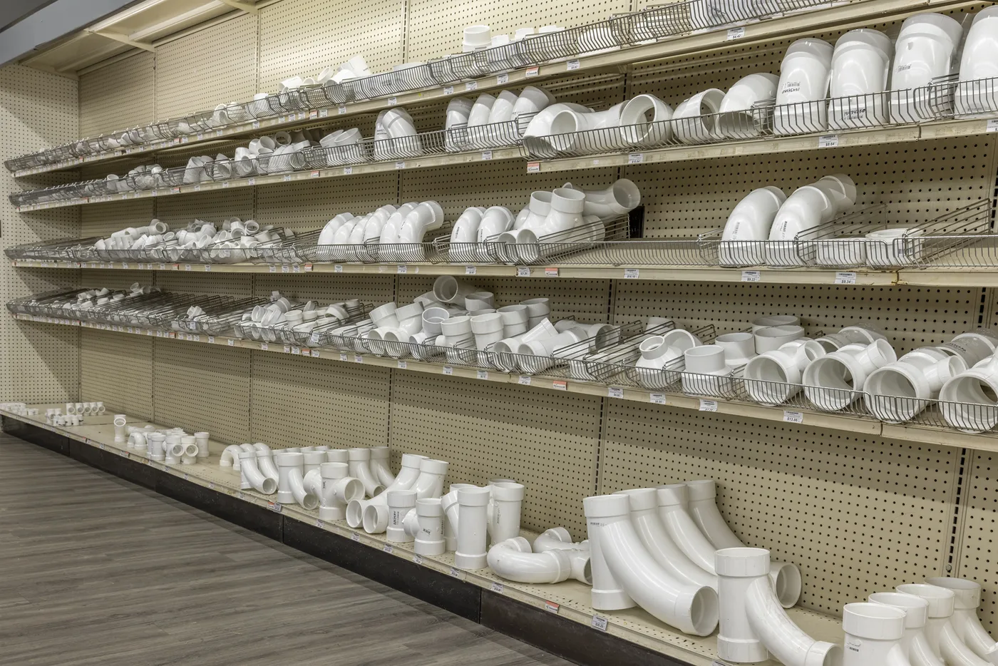 Shelves of plumbing fittings and repair parts