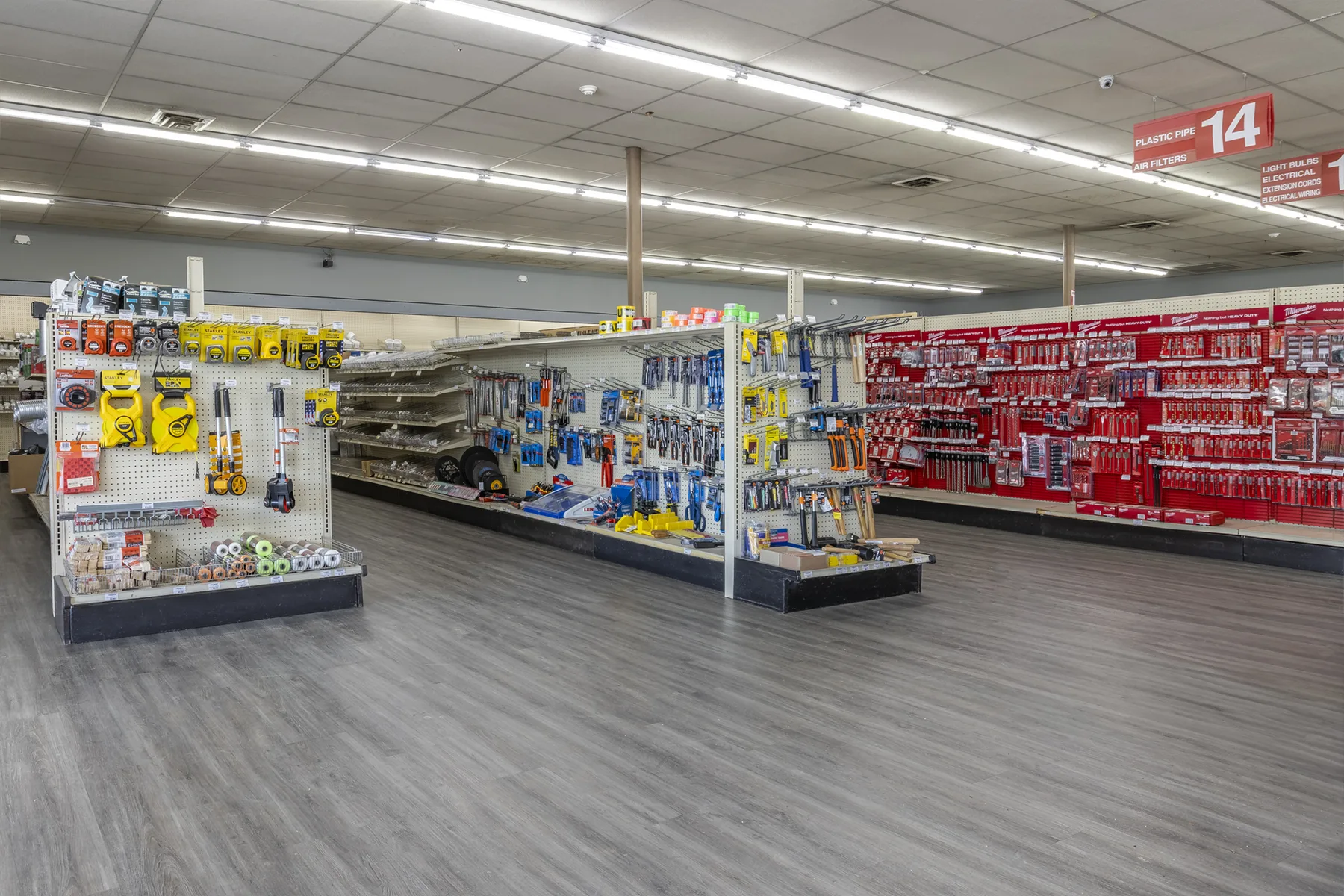 Wide, organized product aisle inside Etowah Builders Supply